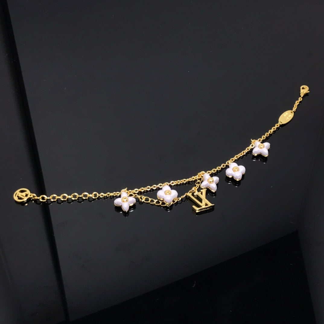 ¡®Aura Jewels¡¯LOGO 6 MOTIF STAR AND SUN GOLD BRACELET