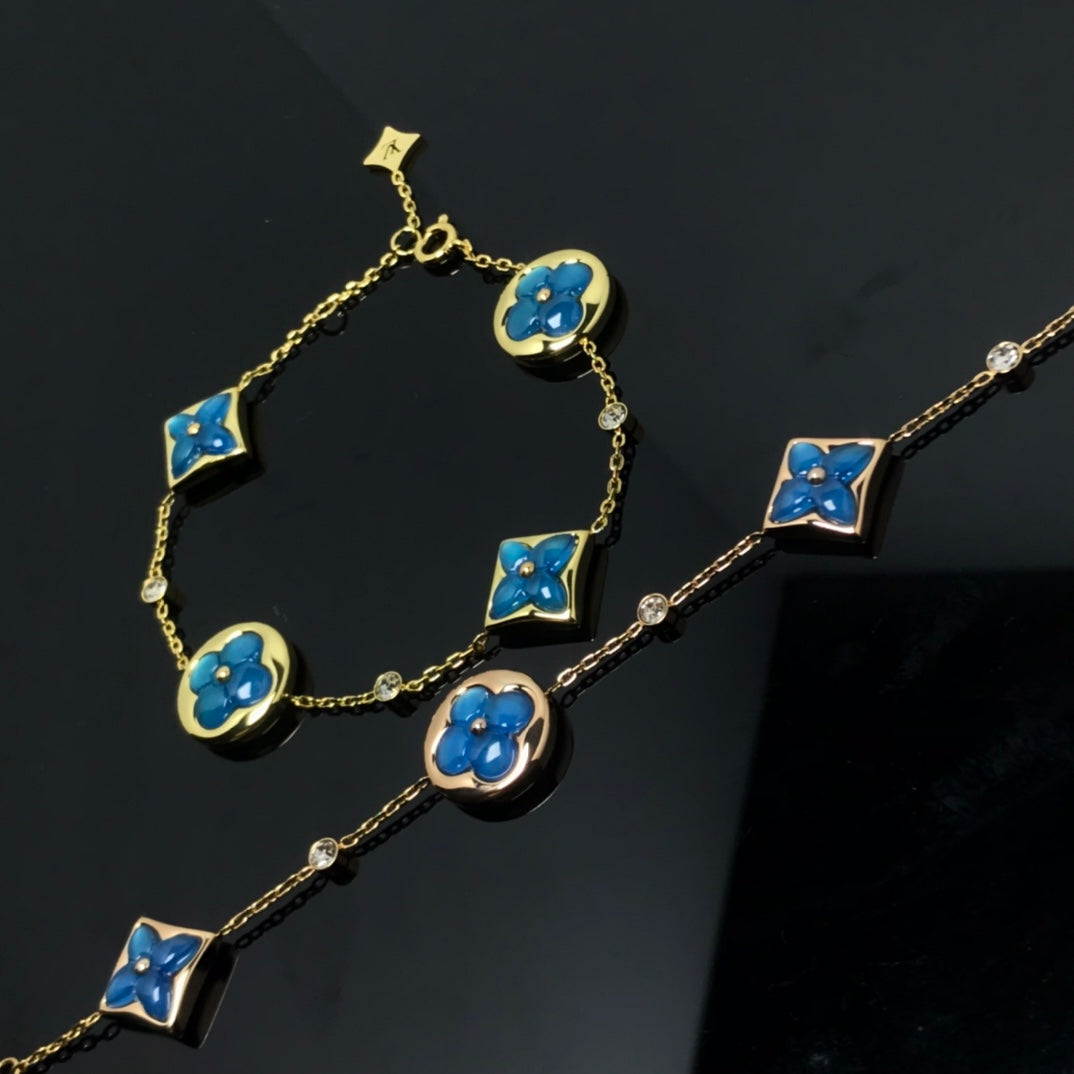 ¡®Aura Jewels¡¯STAR AND SUN 4 MOTIF BLUE BRACELET