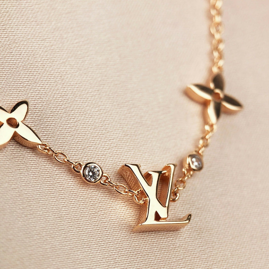 ¡®Aura Jewels¡¯STAR AND SUN 7 MOTIFS GOLD BRACELET