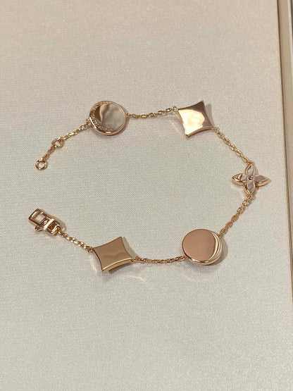 ¡®Aura Jewels¡¯STAR AND SUN 5 MOTIF MOP PINK GOLD BRACELET