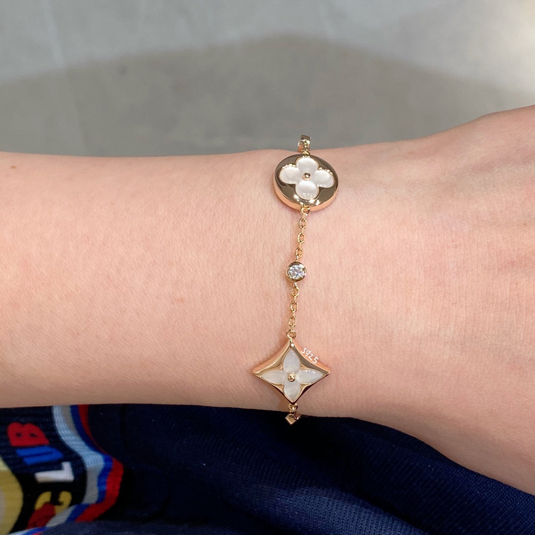 ¡®Aura Jewels¡¯STAR AND SUN 4 MOTIF WHITE MOP PINK GOLD BRACELET