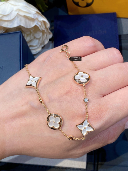 ¡®Aura Jewels¡¯STAR AND SUN 4 MOTIF WHITE MOP PINK GOLD BRACELET