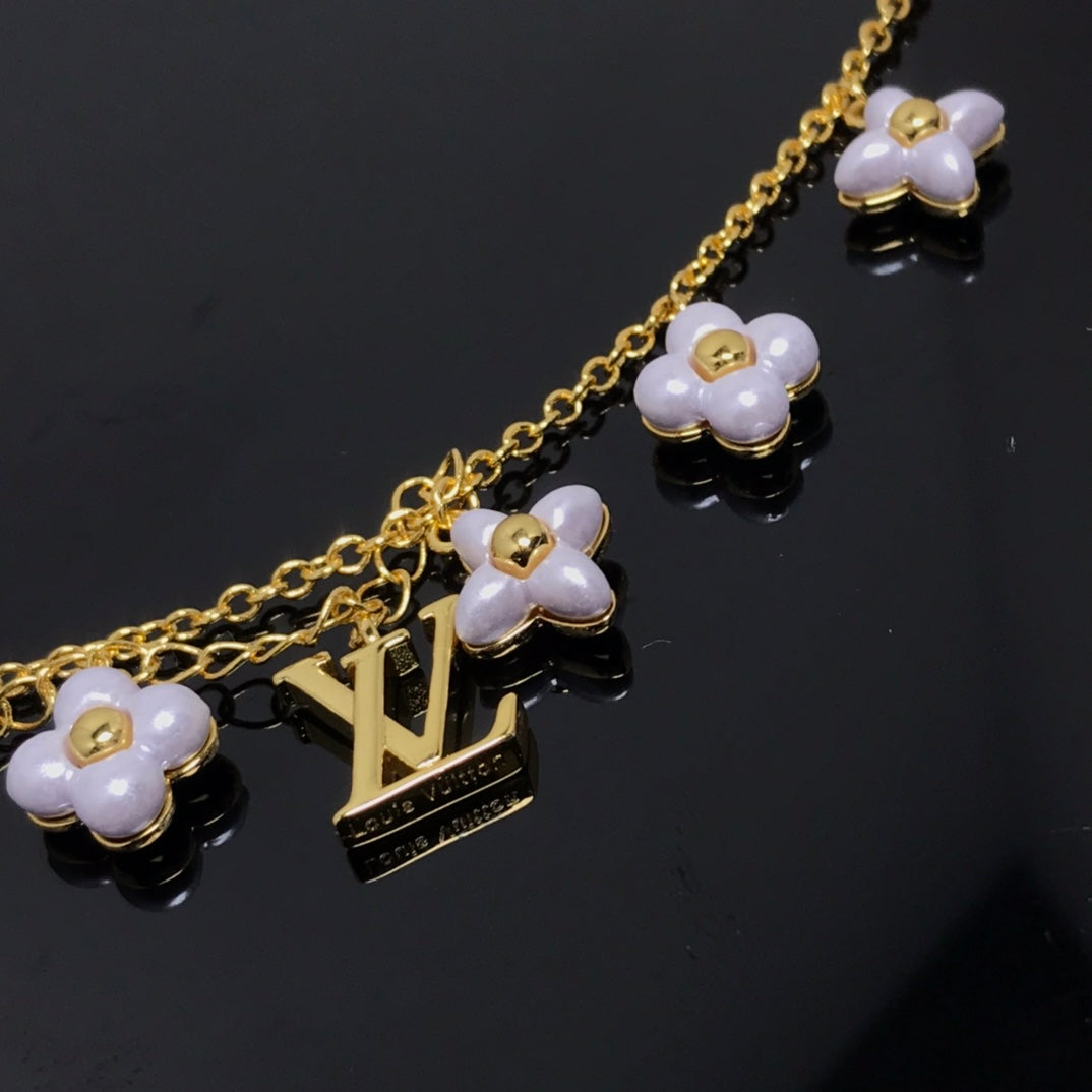 ¡®Aura Jewels¡¯LOGO 6 MOTIF STAR AND SUN GOLD BRACELET