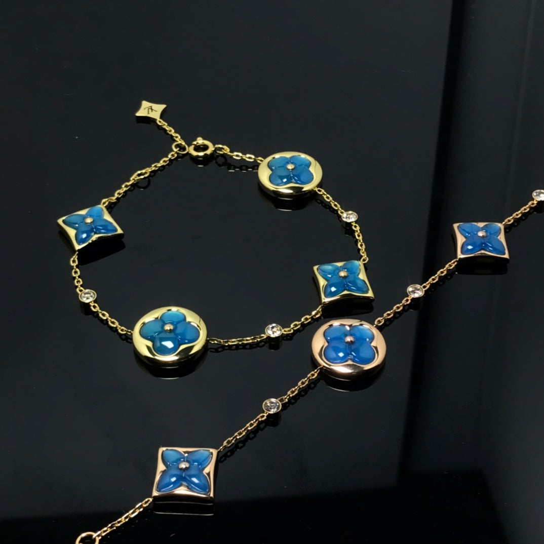 ¡®Aura Jewels¡¯STAR AND SUN 4 MOTIF BLUE BRACELET