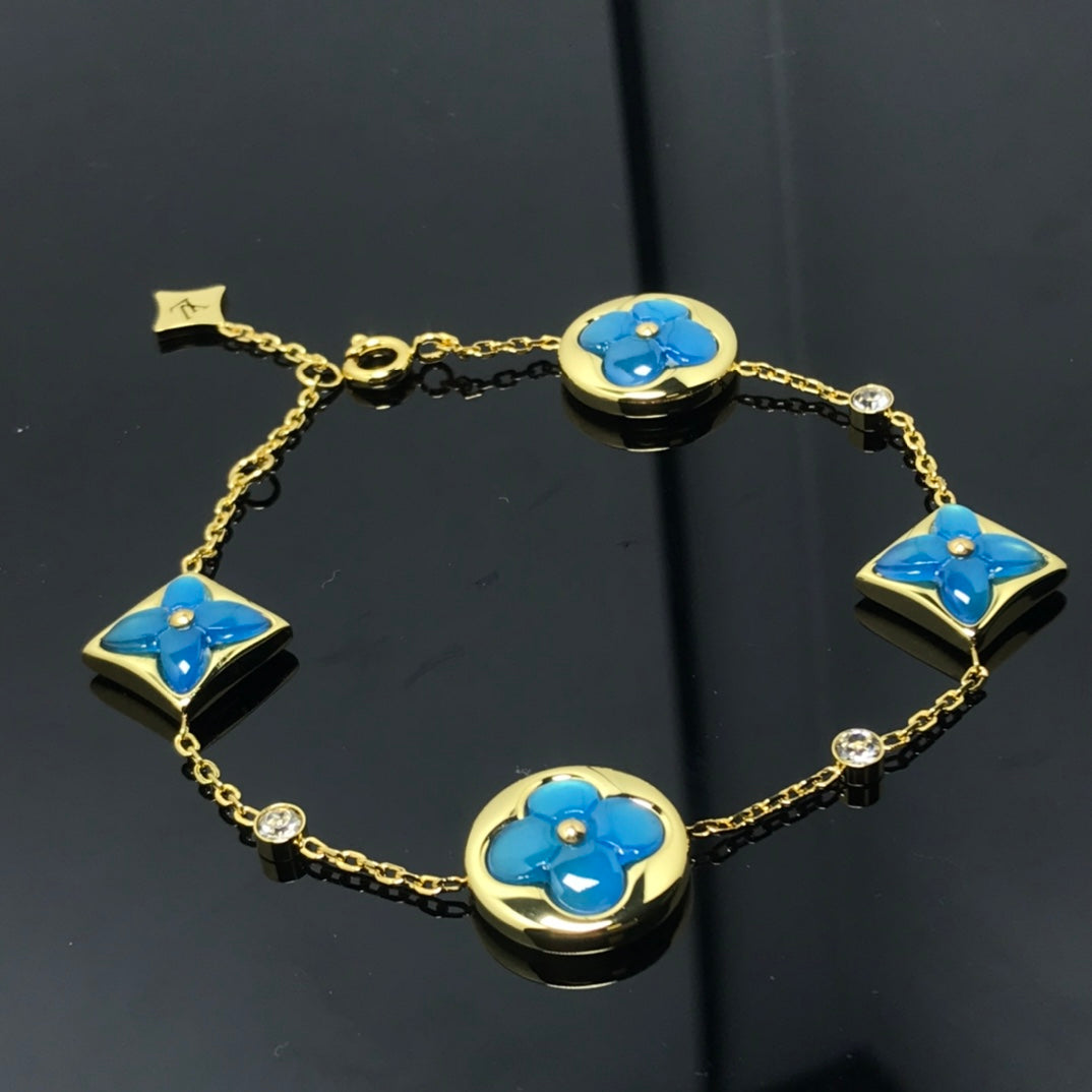 ¡®Aura Jewels¡¯STAR AND SUN 4 MOTIF BLUE BRACELET